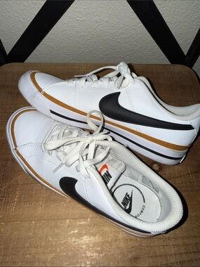 Nike Youth White Sneakers with Black Swoosh and Brown Accent